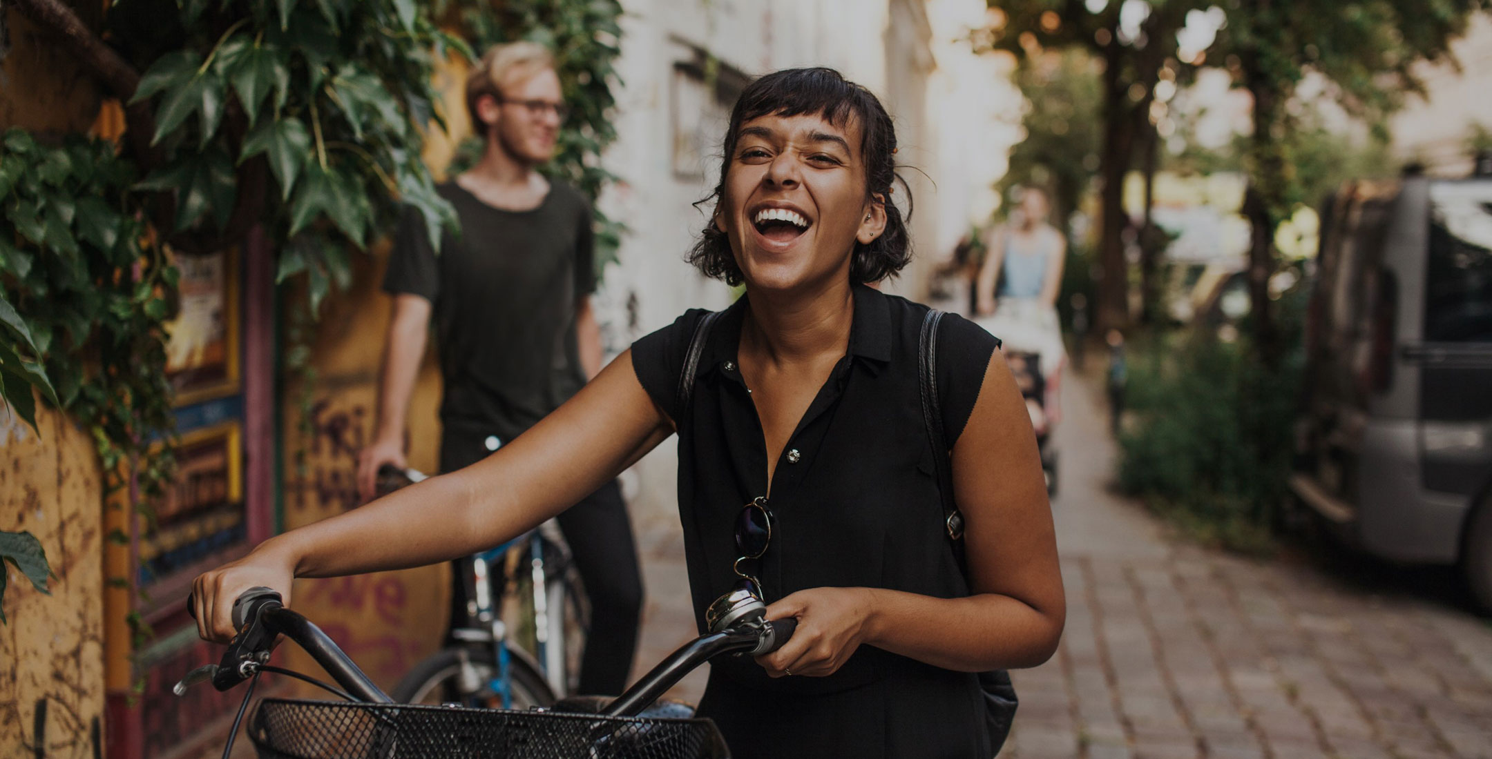 The Line Raleigh smiling woman on a bike